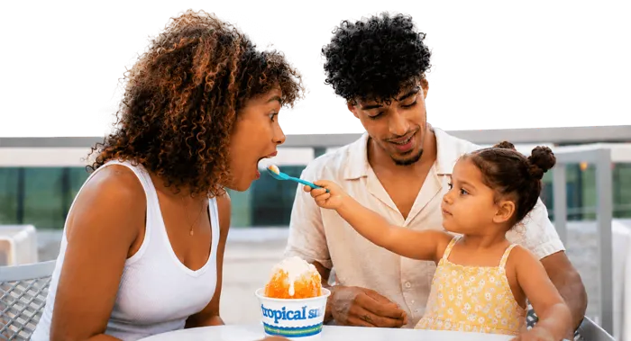 Family enjoying Tropical Sno shaved ice together
